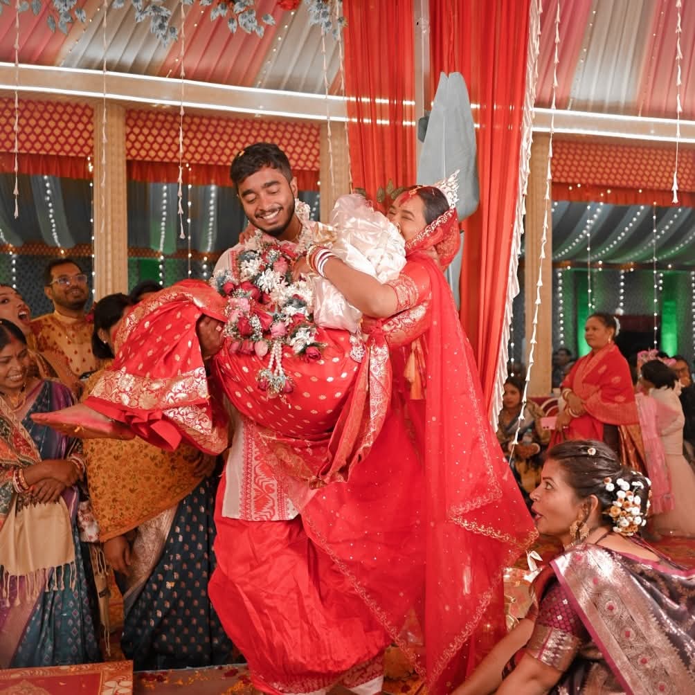 Groom Lifting Bride